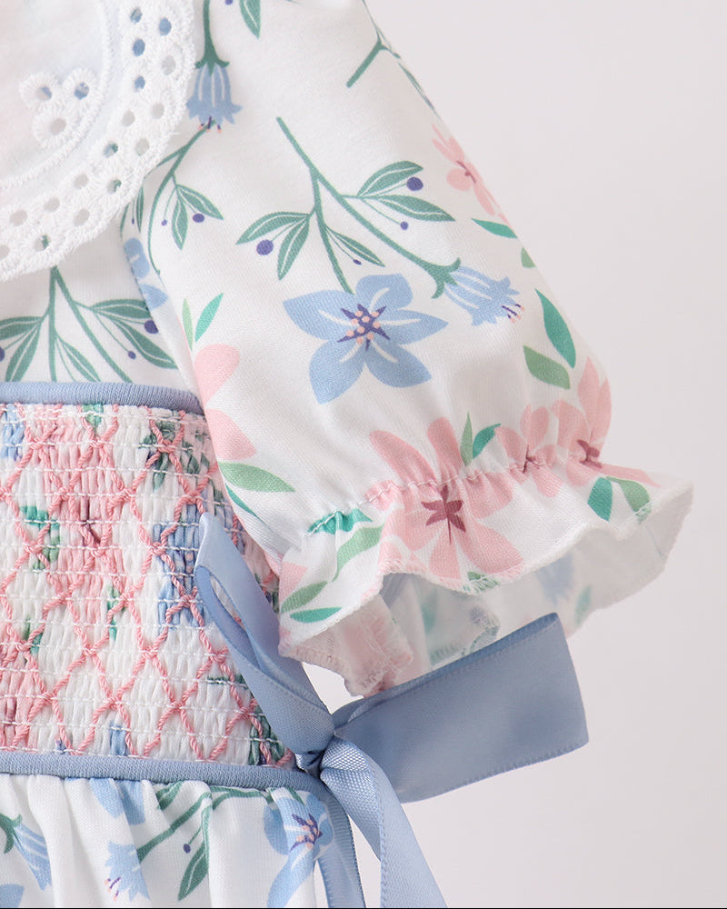 Floral-patterned fabric with a bow on a white background