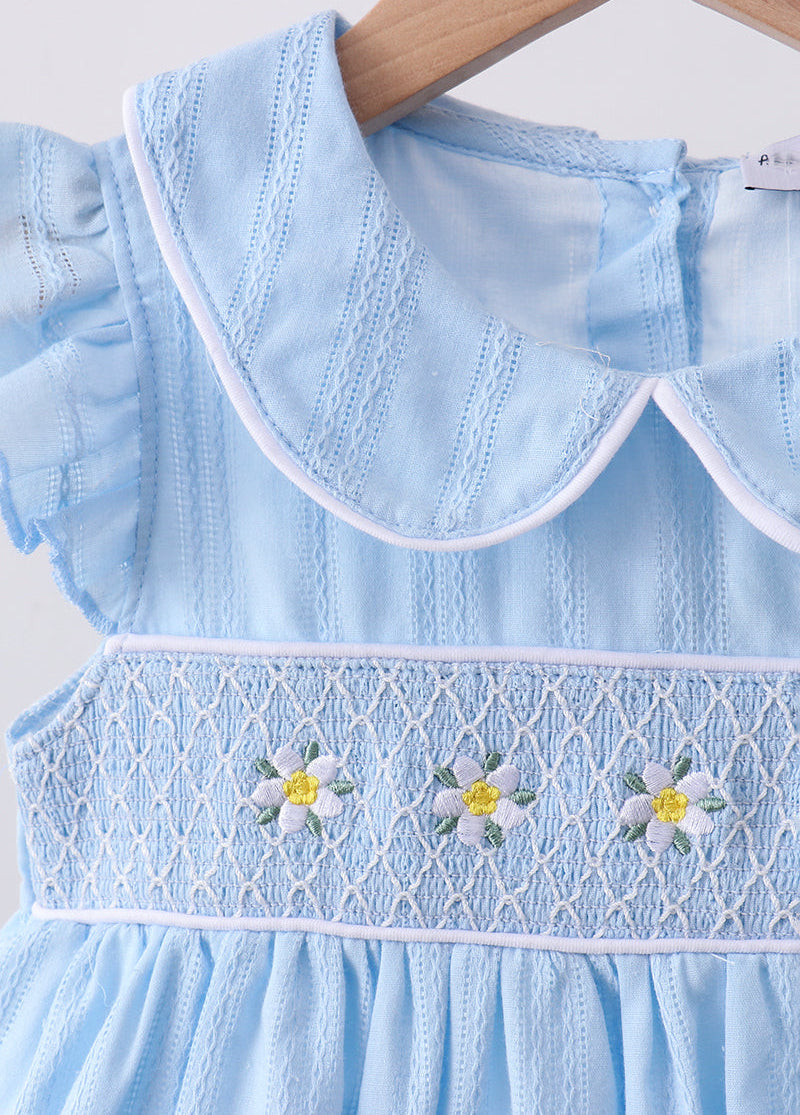 Light blue dress with floral embroidery on a white background