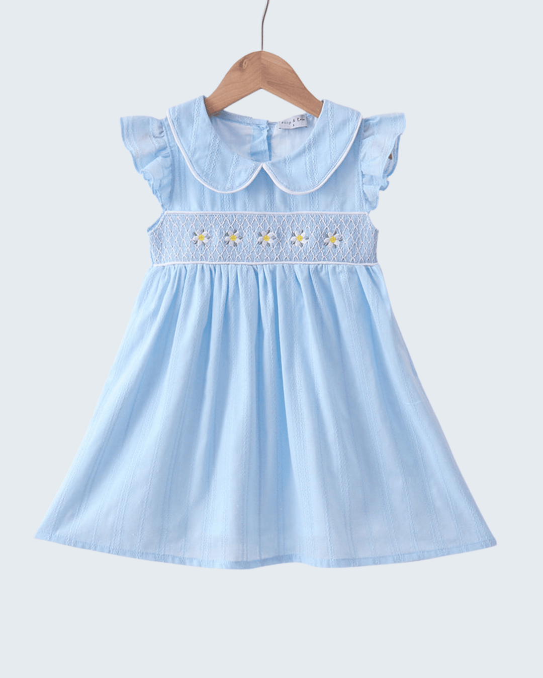 Light blue dress with floral embroidery on a white background