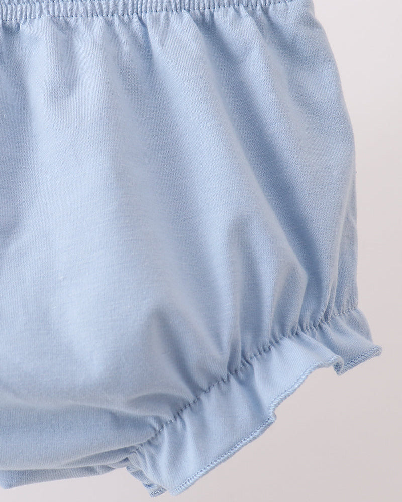Light blue baby bloomers on a light gray background