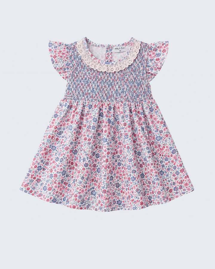 Blue Floral Smocked Ruffle Dress on light grey background