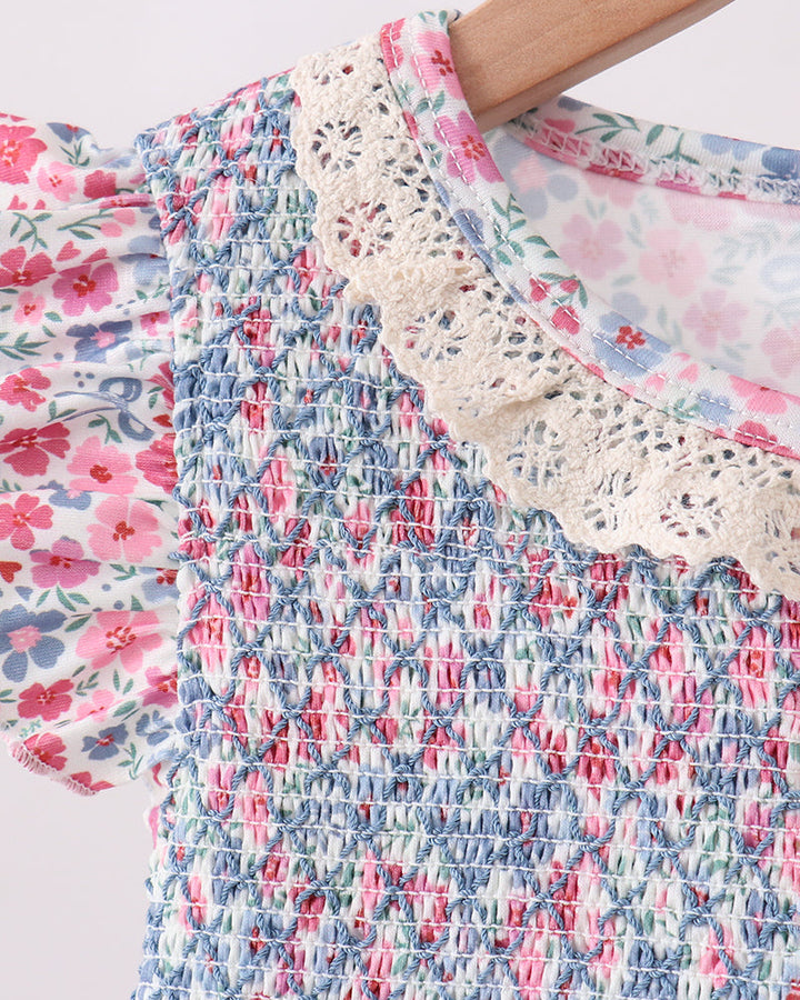 Close-up of a floral fabric with ruffled edge on a light background
