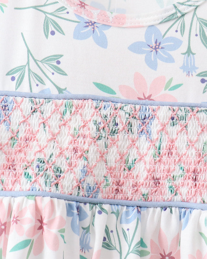 Floral patterned fabric with ruffled edge on a white background