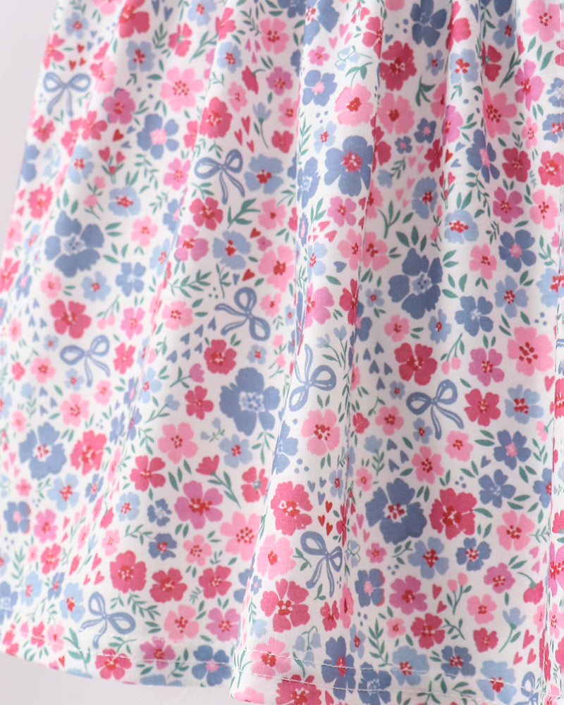 Floral fabric with pink and blue flowers on a white background