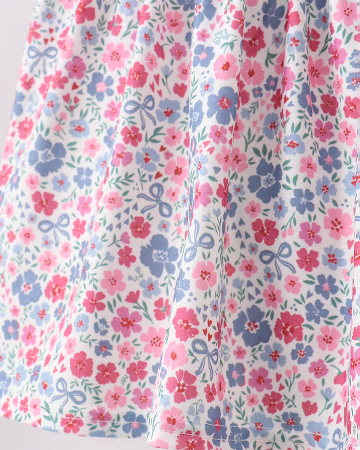 Floral fabric with pink and blue flowers on a white background