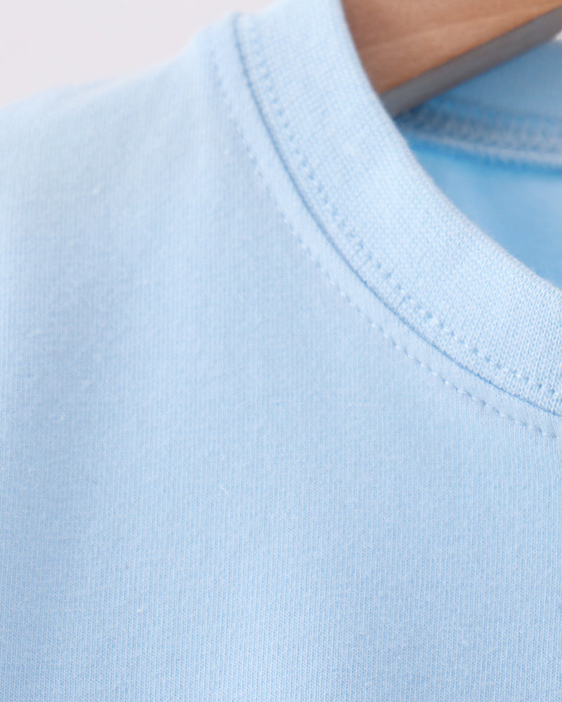 Light blue crew-neck t-shirt with double-stitched collar seam