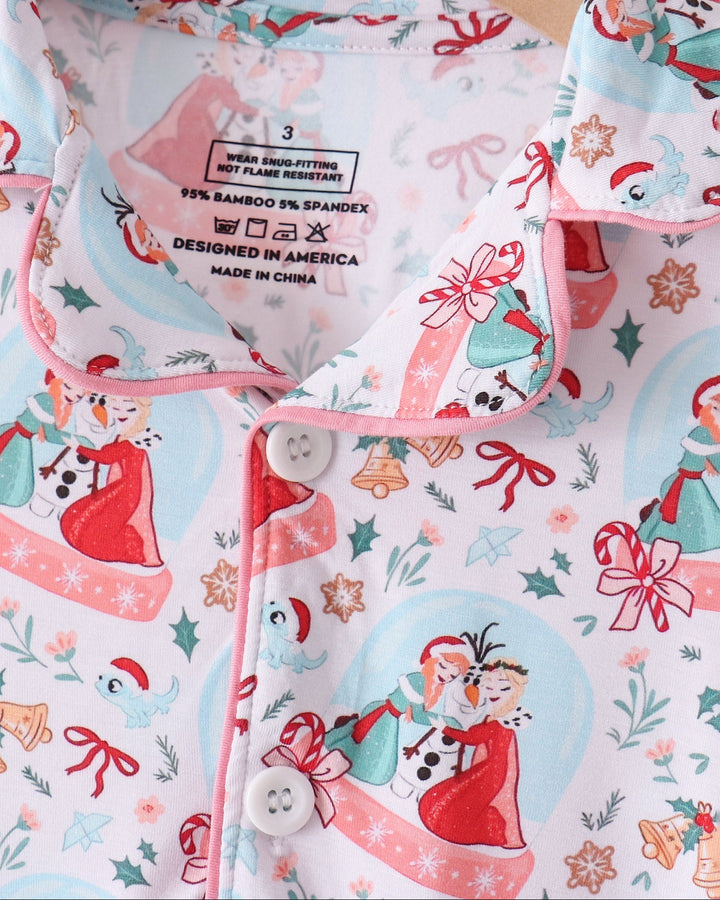 Light blue pajama top close-up with button placket, collar, and size/care label