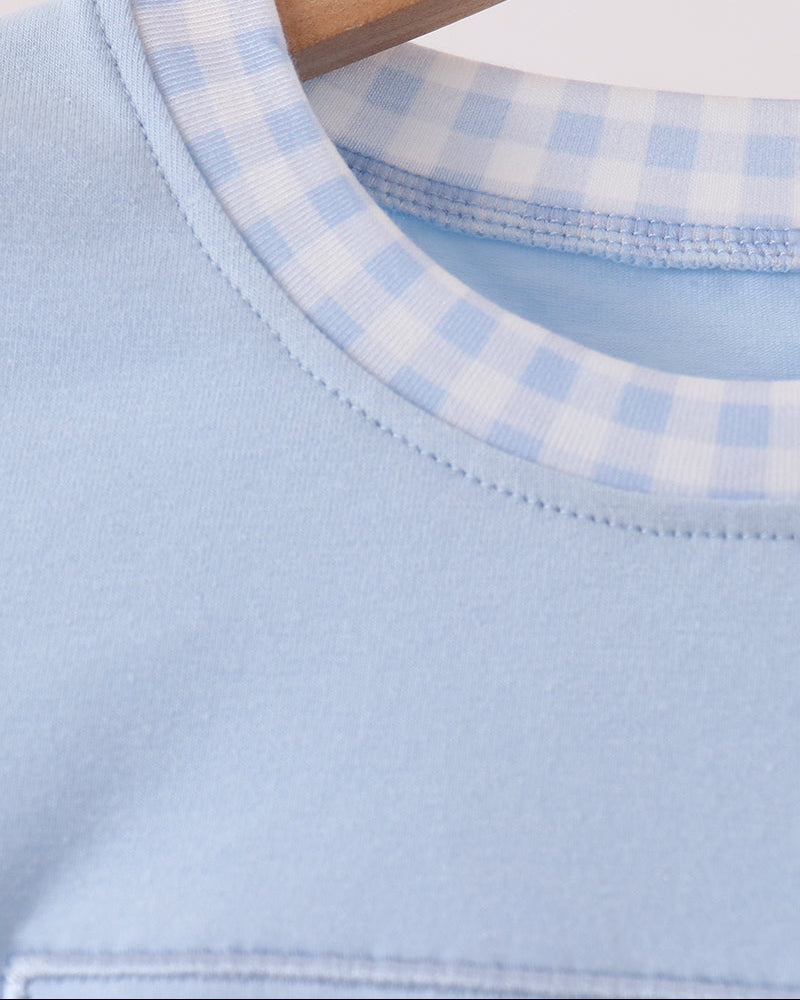Light blue bubble romper neckline with contrast light blue gingham binding