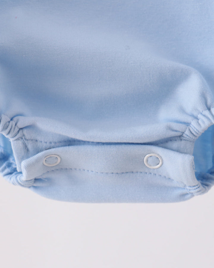 Light blue bubble romper back with gathered hem and snap closure