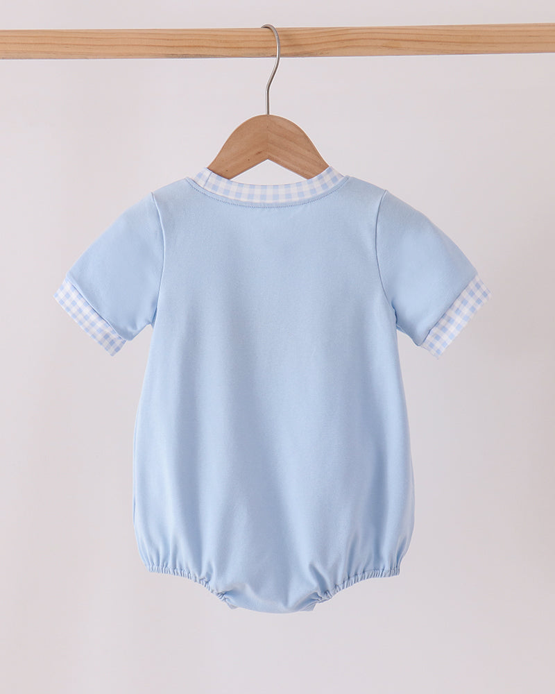 Light blue bubble romper with gingham collar and short sleeves on hanger
