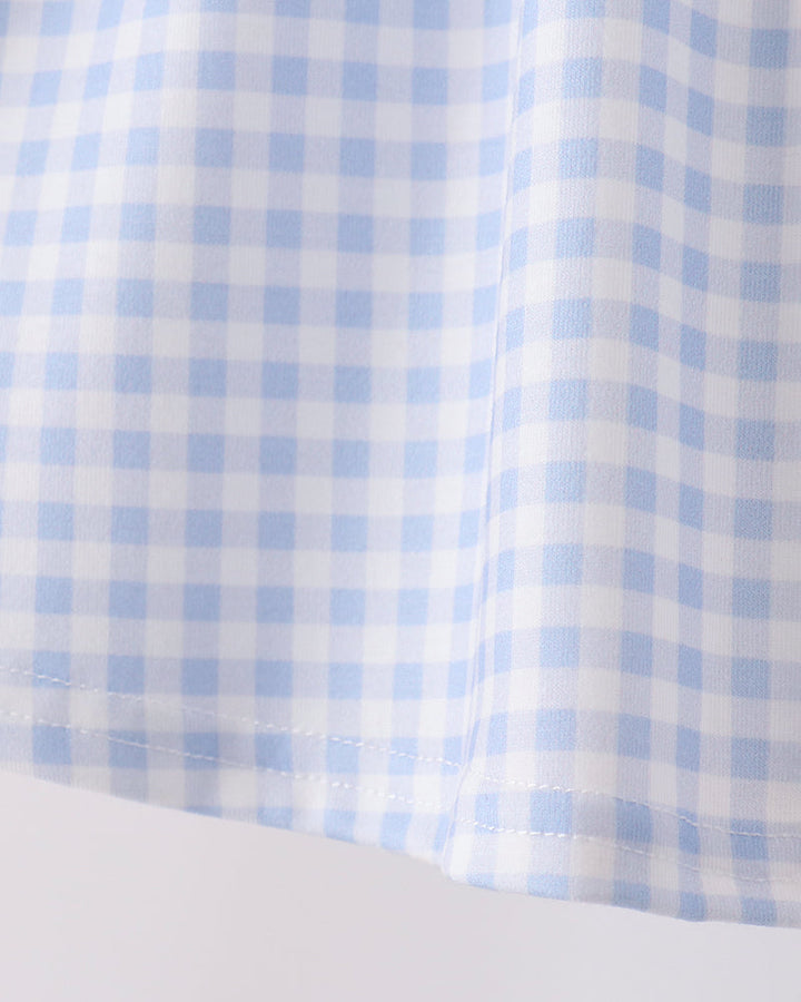 Blue gingham ruffle top with gathered hem detail