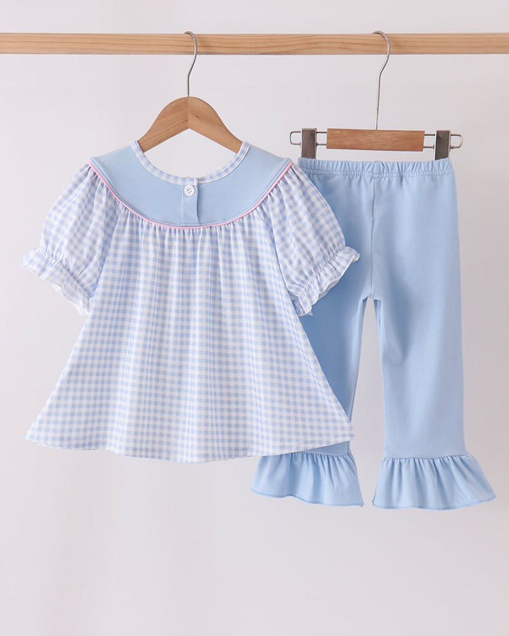 Blue gingham top paired with light blue ruffle bell pants, ghost applique