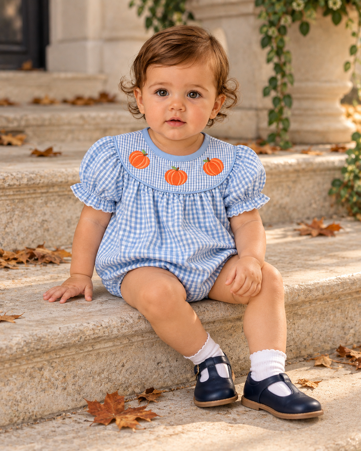 Light blue gingham baby bubble romper with orange pumpkin accents at the chest