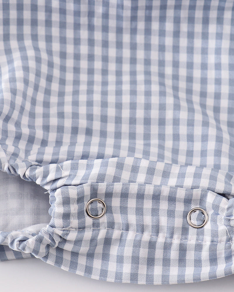 Blue gingham bubble romper back with snap buttons at waist and ruching at leg