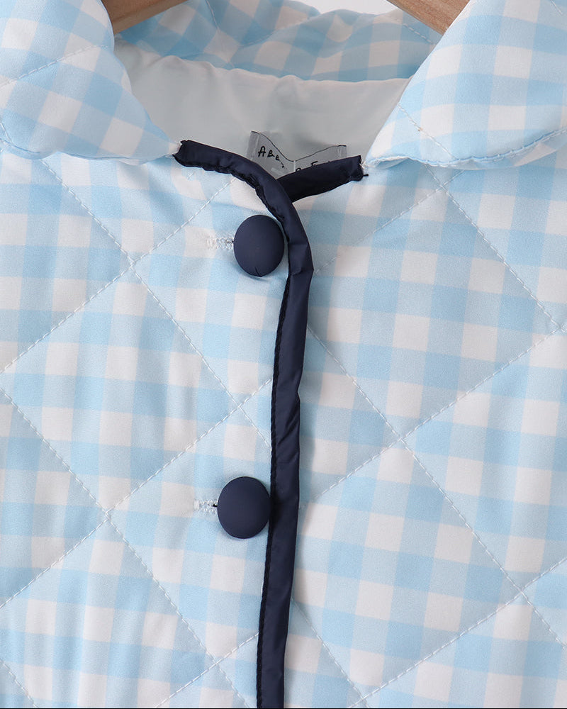 Light blue gingham jacket collar with black buttons and inner lining