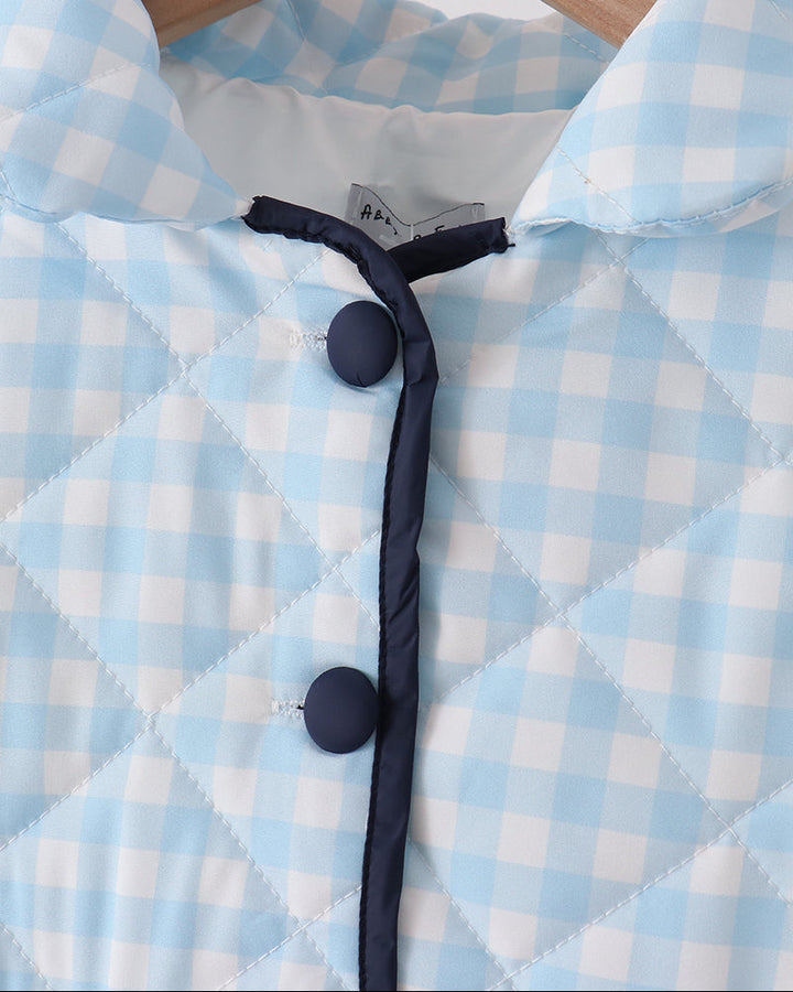 Light blue gingham jacket collar with black buttons and inner lining