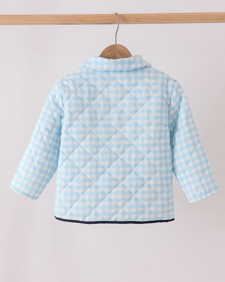 Light blue gingham jacket back with quilted panel seams and buttoned hem edge