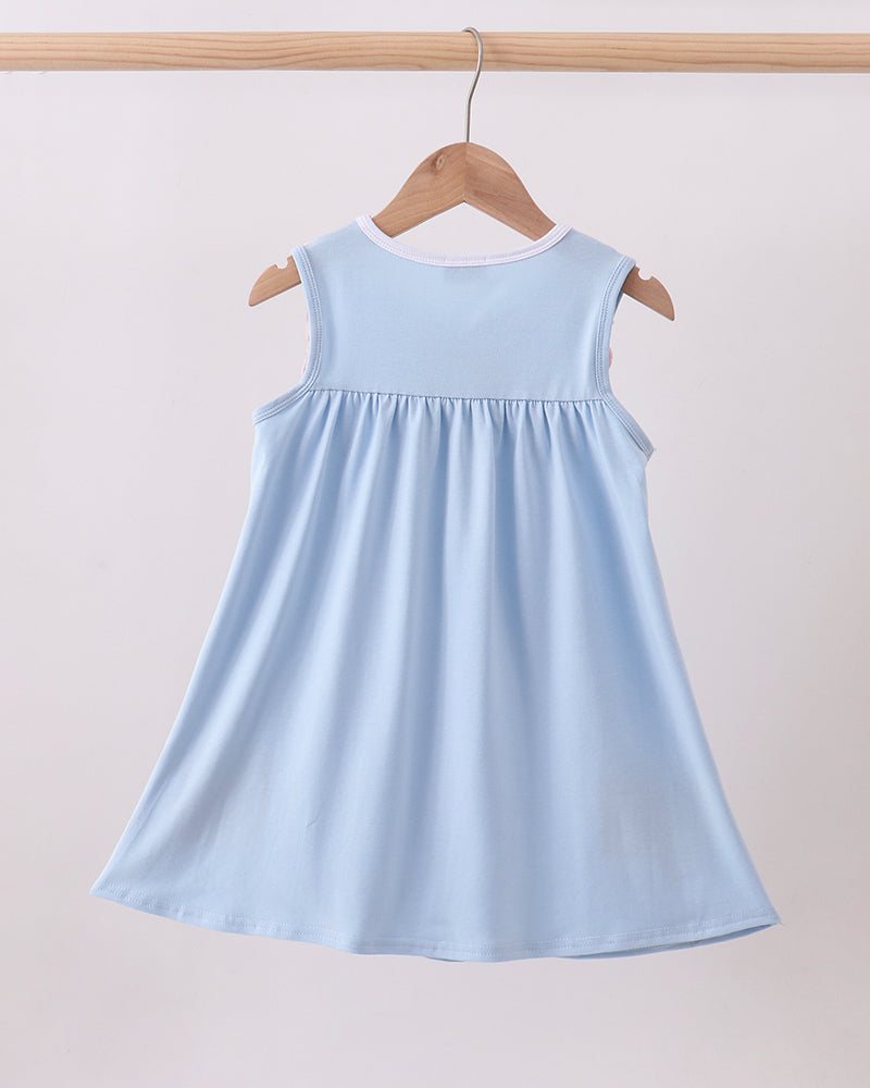 Light blue dress on a wooden hanger against a plain background