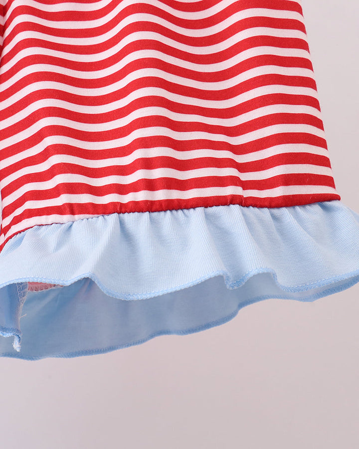 Red and white striped shorts with a blue ruffled hem on a light gray background