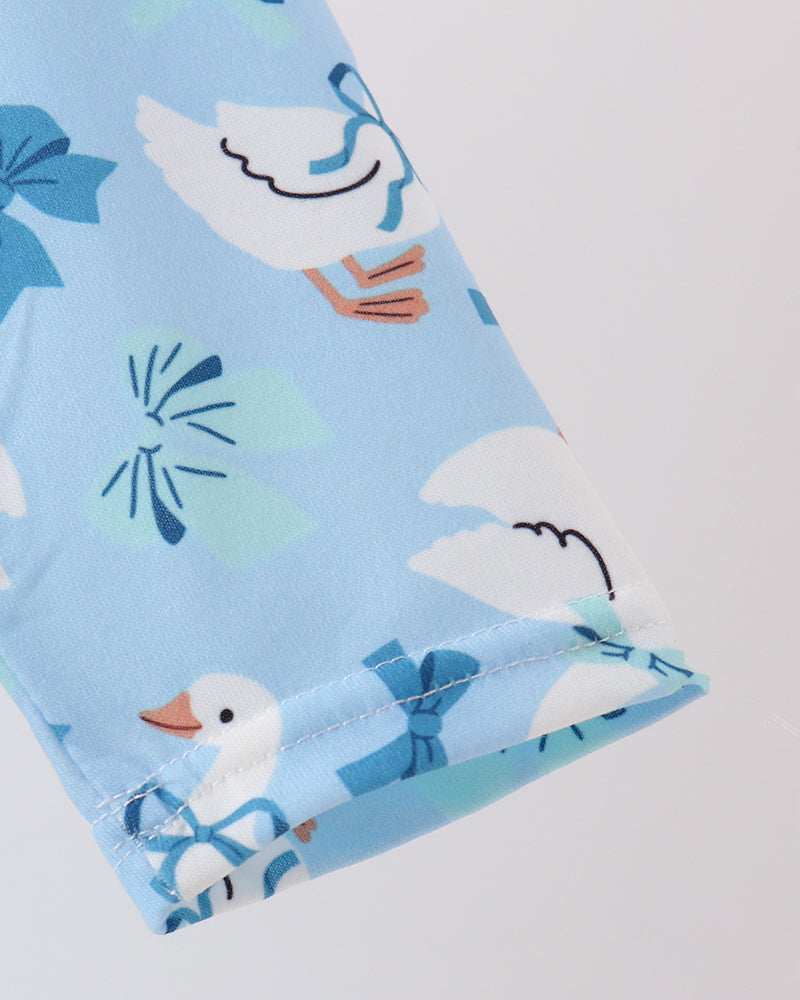 Light blue long-sleeve dress with goose-and-bow print and cuff ruffles
