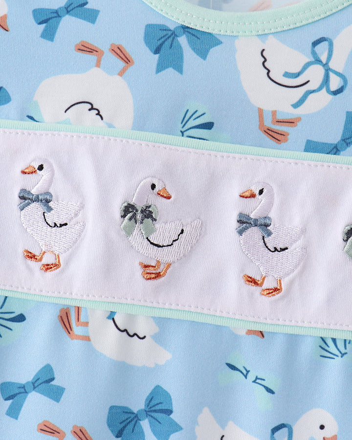 Light blue dress with white embroidered goose yoke and mint trim band