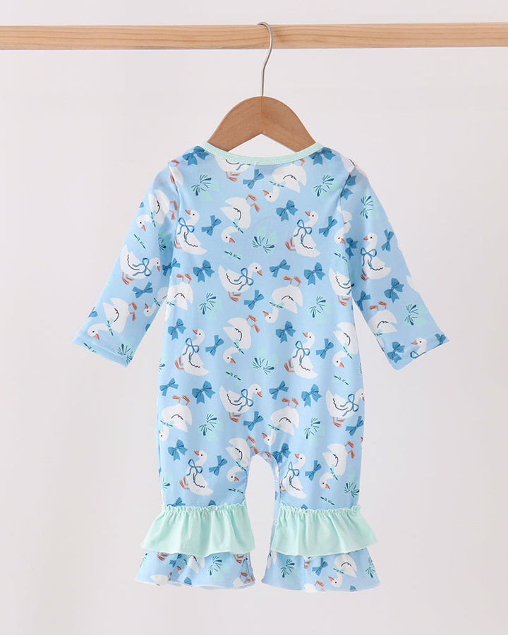 Blue baby romper with allover animal print and mint ruffle hem, back view.
