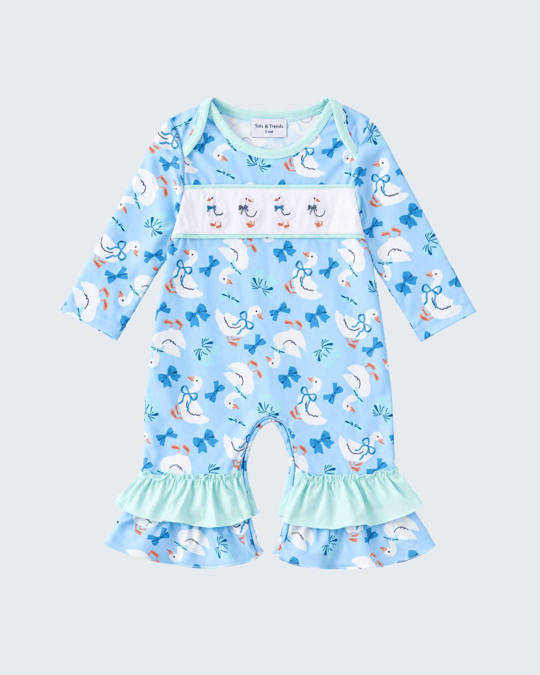 Blue animal-print baby romper with long sleeves and mint ruffle hem.