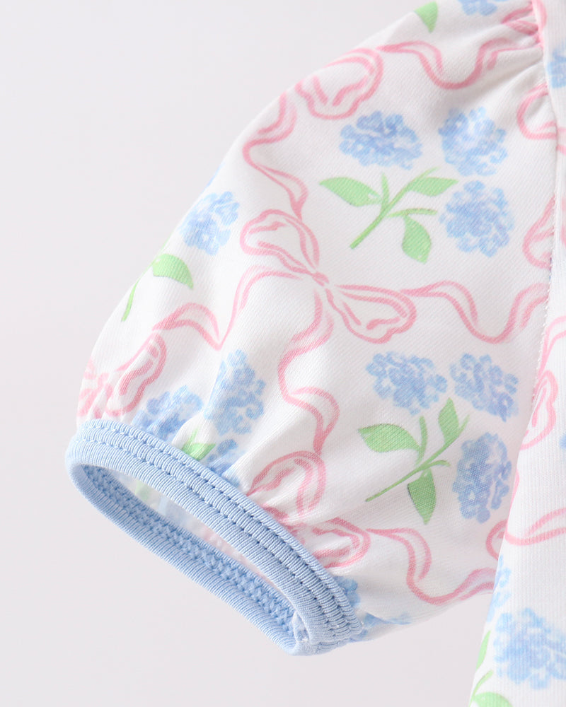 Baby outfit with floral pattern on a white background