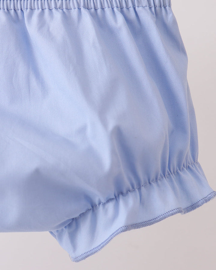 Light blue shorts on a plain background