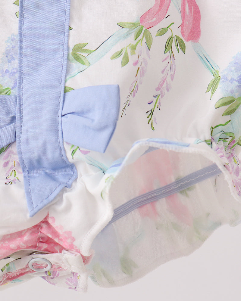 Baby outfit with floral pattern on a white background