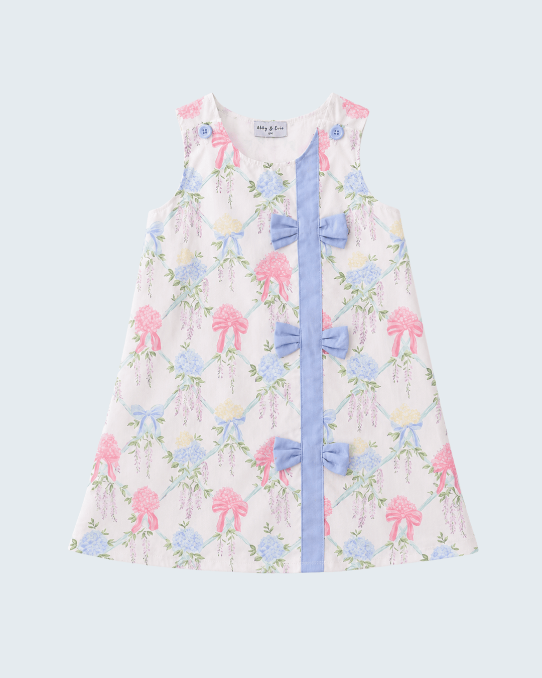 Floral dress with blue ribbon on a light gray background