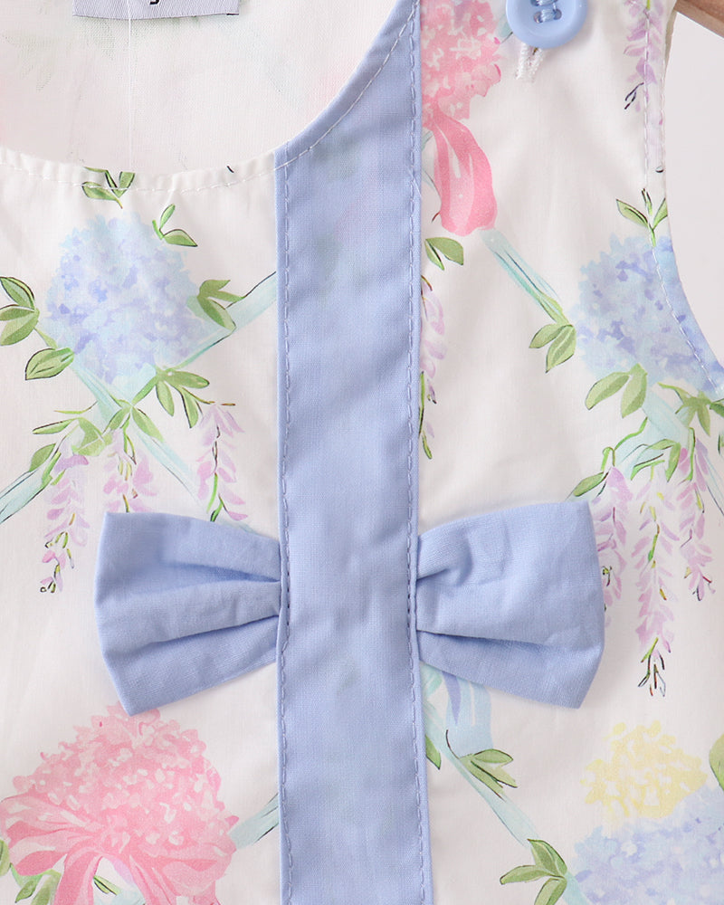 Light blue bow tie on a floral background