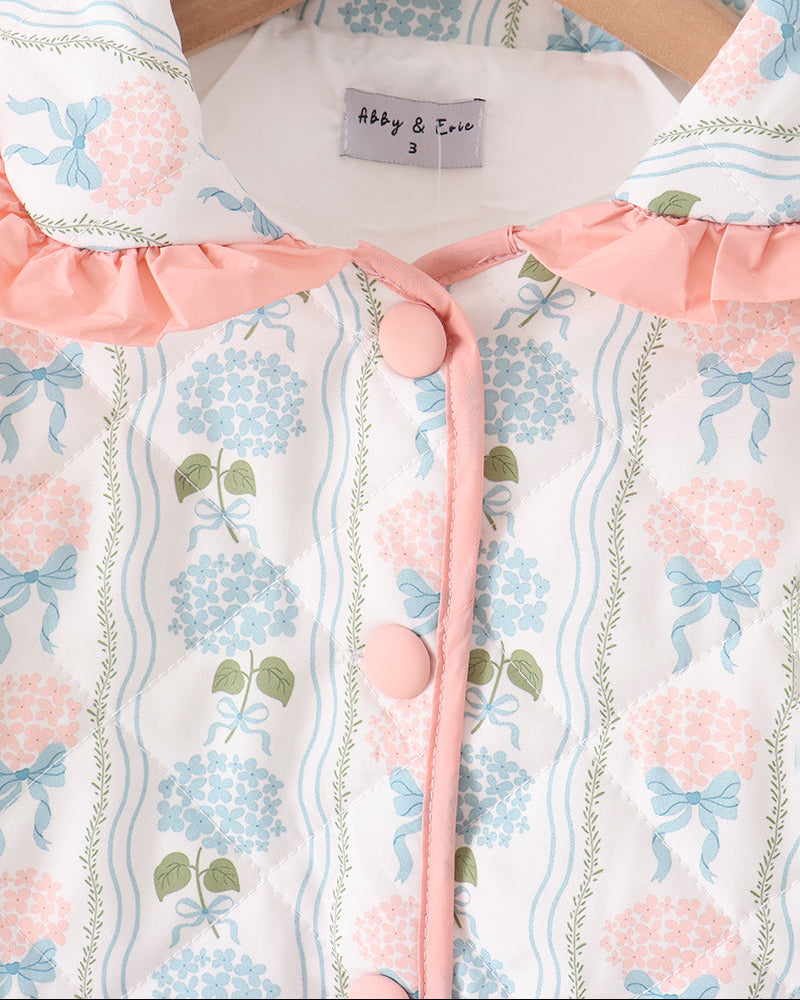 Blue patterned jacket with pink ruffled trim and front snap-button placket