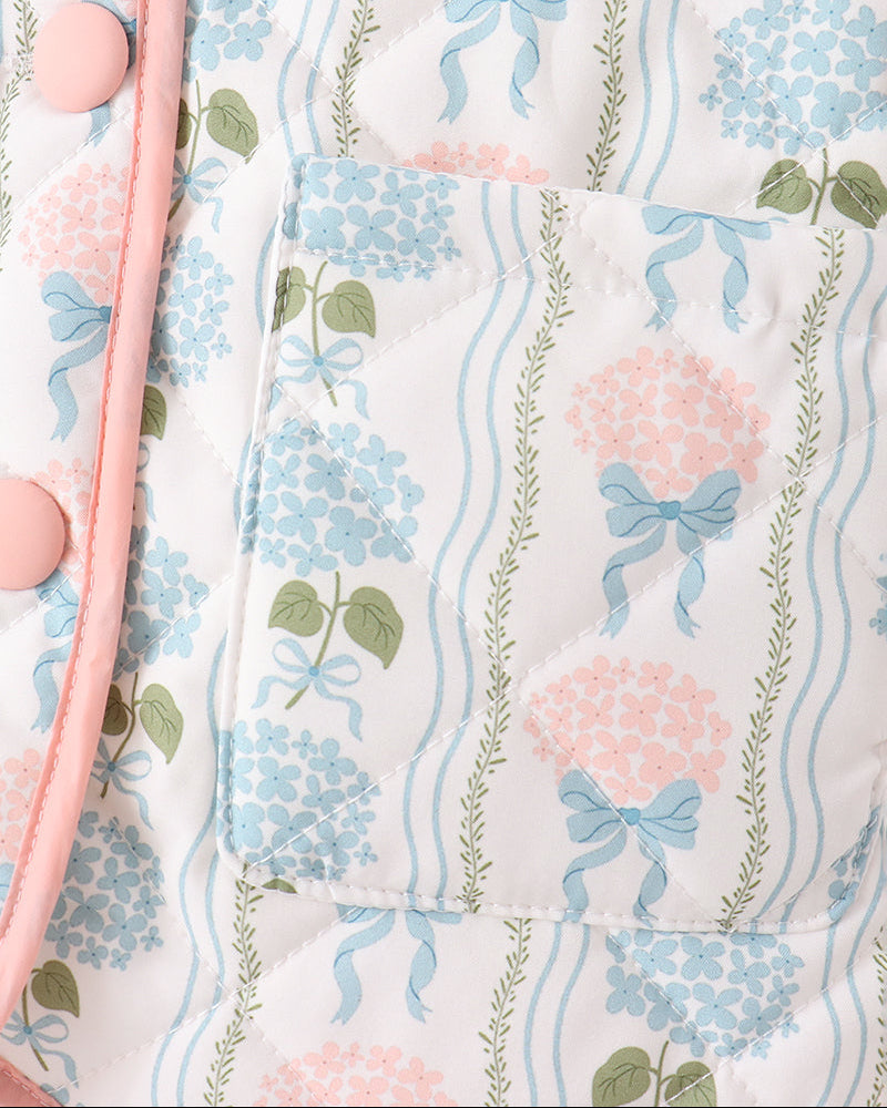 Blue floral jacket with pink piping and round button detail on front panel
