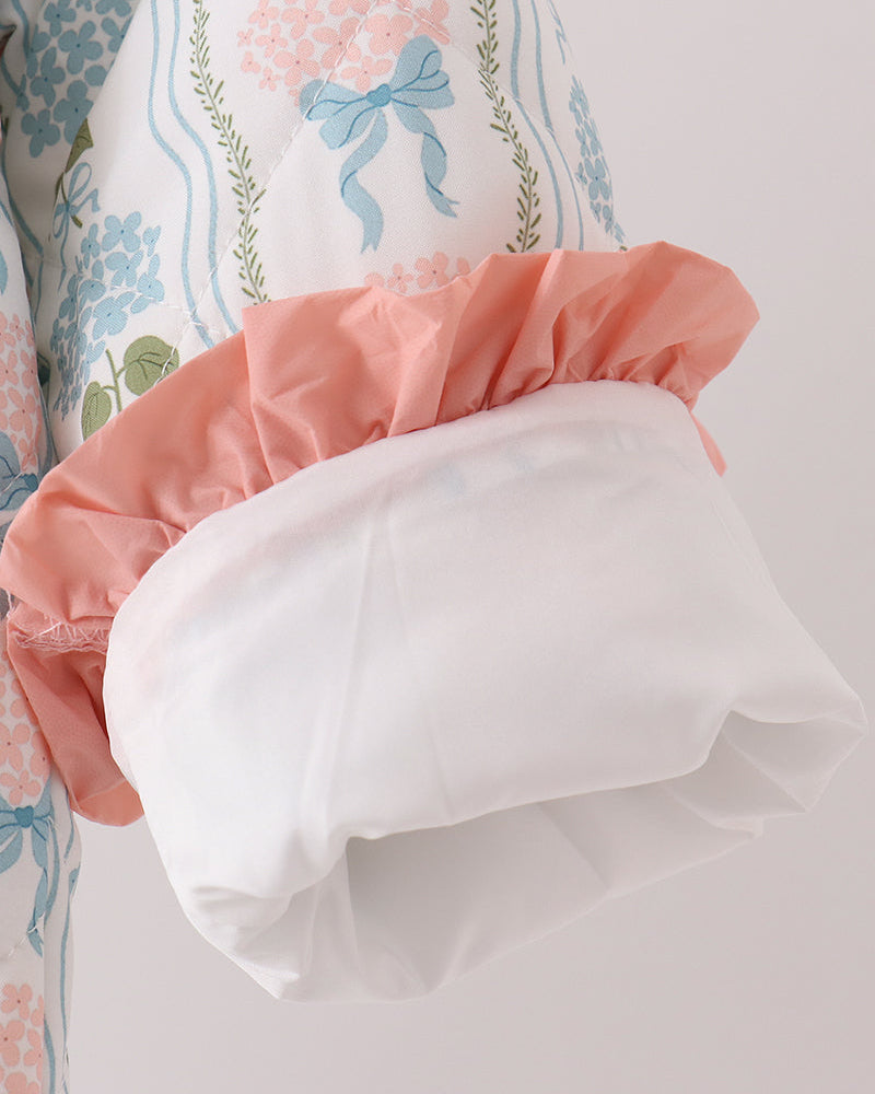 Blue floral jacket with white and peach layered ruffle shoulder trim