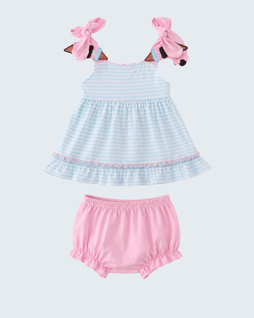 Baby dress and bloomers set with pink headbands on a white background