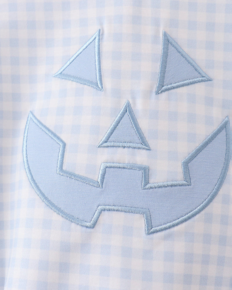 Light blue gingham jack-o-lantern applique on baby romper front
