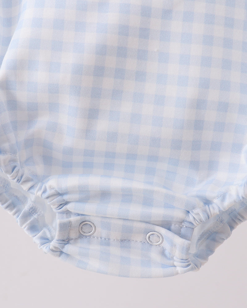 Light blue gingham bubble romper with snap buttons and gathered leg openings