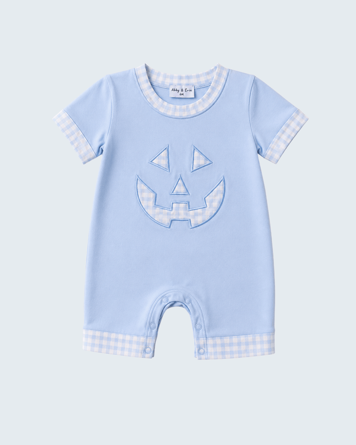 Light blue short-sleeve romper with jack-o-lantern face applique and check trim