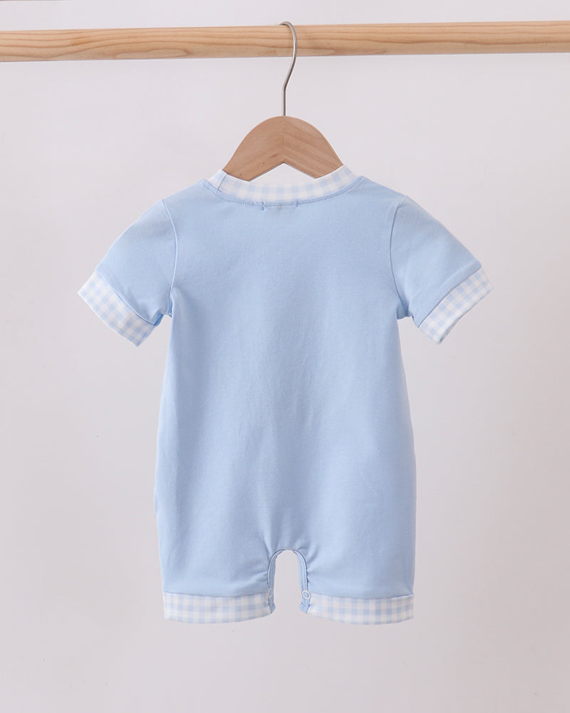 Light blue infant romper with short sleeves and checkered leg hem