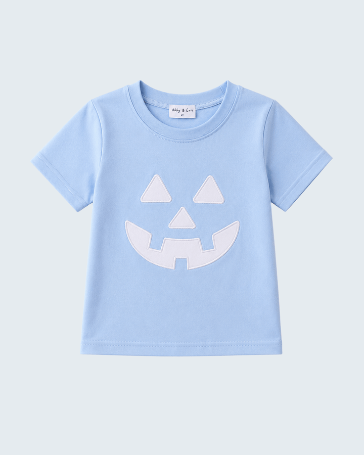 Light blue short-sleeve top with white jack-o-lantern applique face