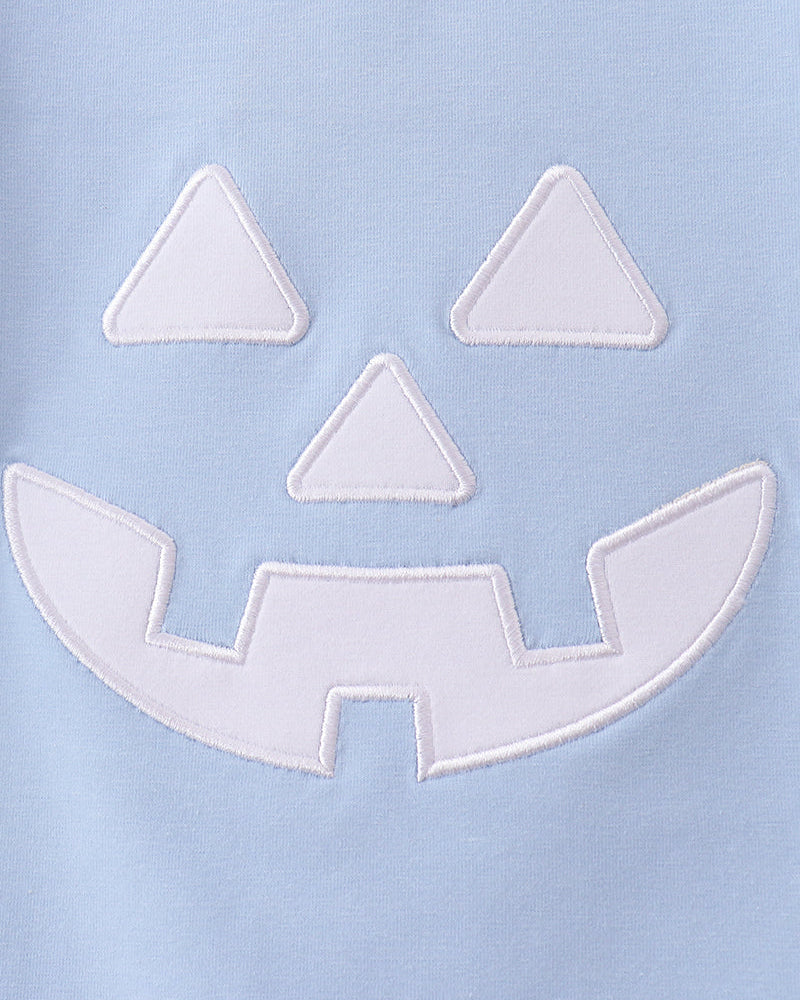 Jack-o-lantern face applique detail on light blue t-shirt