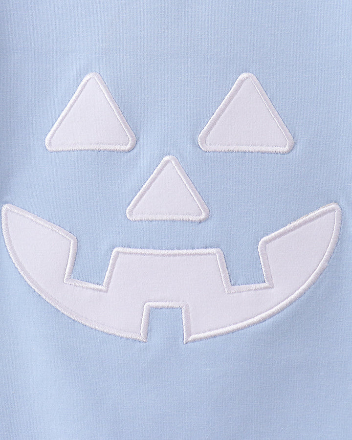 Jack-o-lantern face applique detail on light blue t-shirt