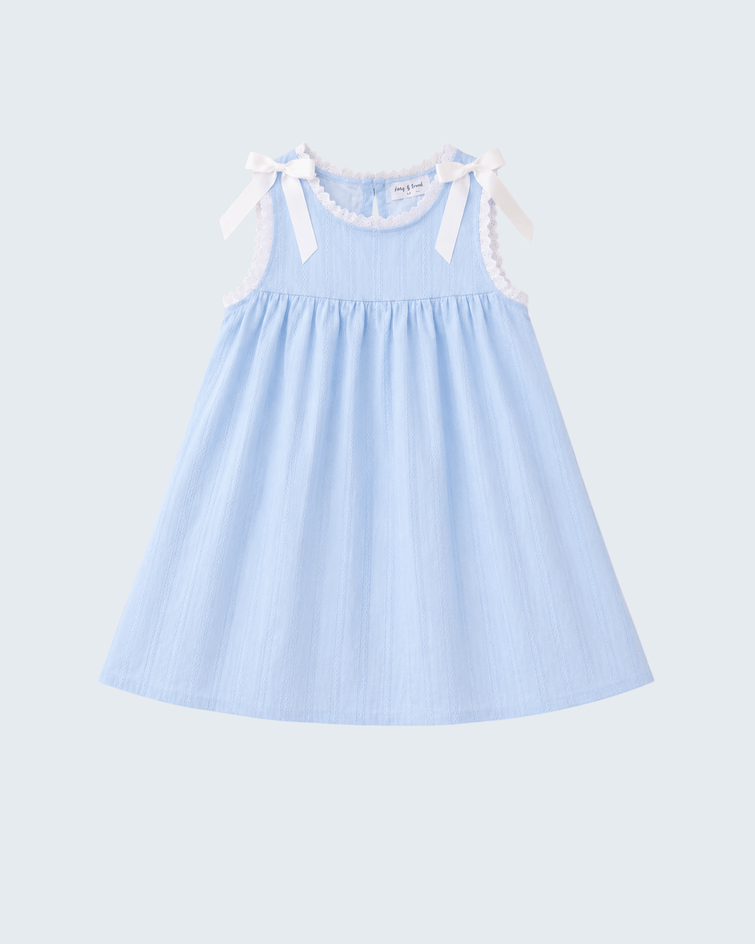 A light blue sleeveless baby dress with white lace trim and ribbon bows on the shoulders, shown against a light gray background.