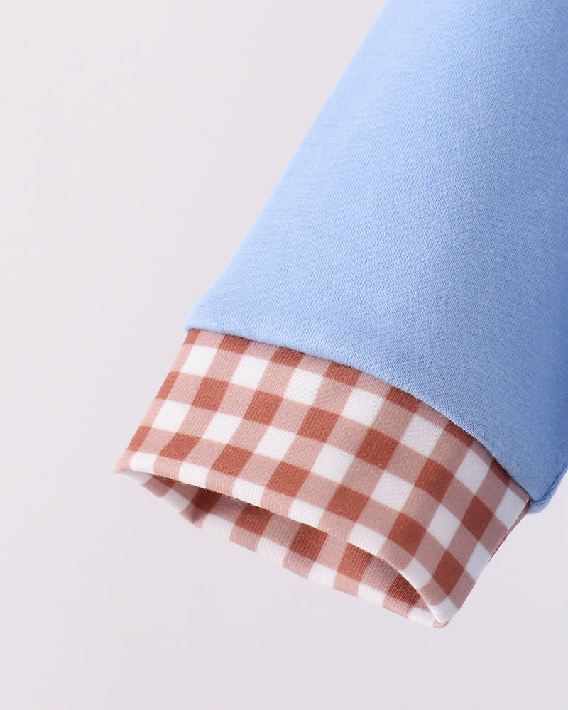 Light blue baby romper sleeve with orange-and-white plaid cuff
