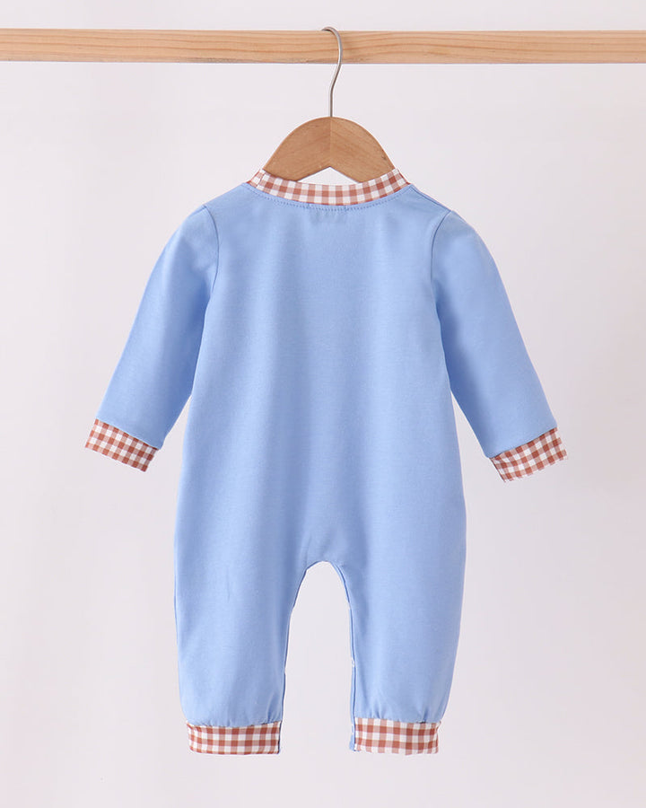 Light blue long-sleeve baby romper with orange-and-white plaid cuffs