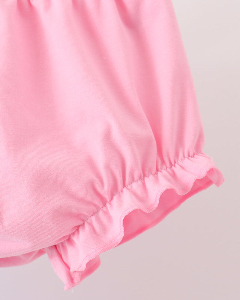 Pink bloomer shorts with gathered waist and ruffled hem