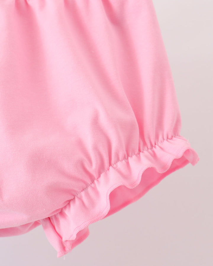 Pink bloomer shorts with gathered waist and ruffled hem
