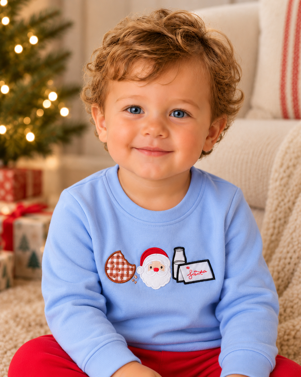 Blue sweatshirt with Christmas cookies, Santa, and milk graphic