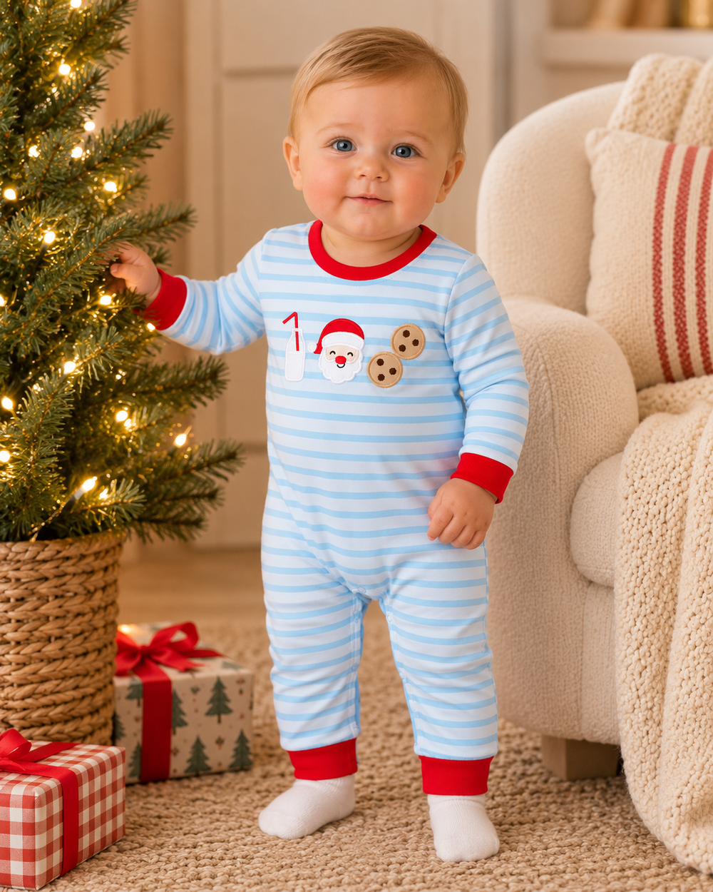 Light blue striped baby romper on toddler, red cuffs and white socks